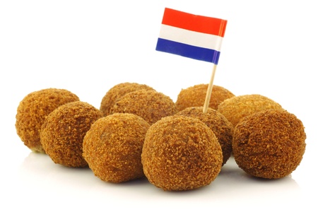 A real traditional Dutch snack called  bitterballen  with a Dutch flag toothpick on a white background の写真素材
