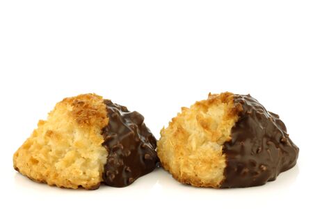 freshly baked cocos and chocolate cookies on a white background の写真素材