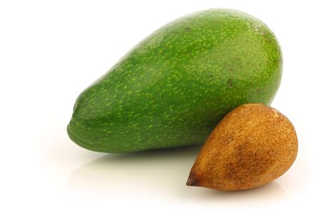 fresh and ripe avocado and a seed on a white background の写真素材