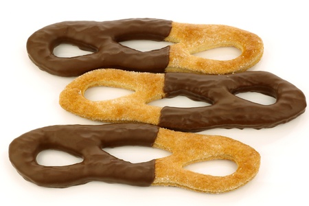 traditional sugar and chocolate coated Dutch cookies called  krakeling  on a white background の写真素材