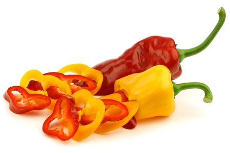 cut red and yellow sweet pepper capsicum  on a white background の写真素材