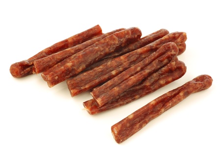 traditional frisian dried sausage sticks on a white backgroundの写真素材