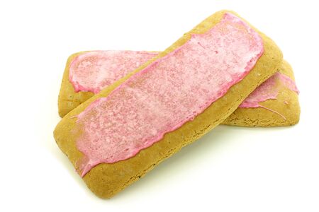 traditional Dutch and Frisian pink glazed pastry called  fondant koek  on a white background の写真素材
