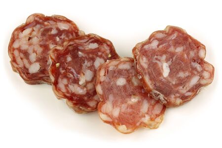 luxury sausage pieces on a white background の写真素材