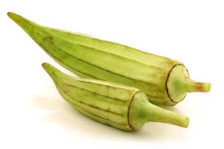 fresh raw okra pods  Abelmoschus esculentus  on a white background の写真素材