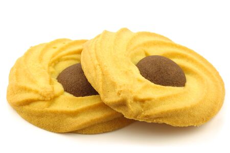 traditional dutch cookies called  sprits  with a chocolate centre on a white background の写真素材