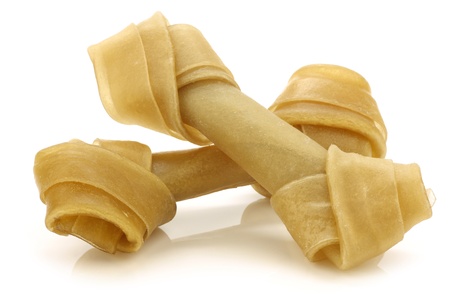 tasty dog treats on a white background の写真素材