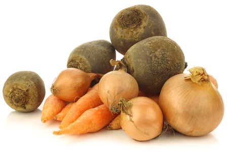 variety of root vegetables on a white background の写真素材