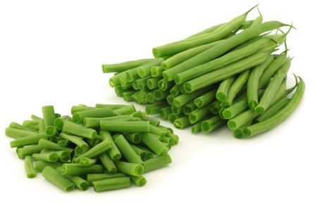 cut small and slender green beans  haricot vert  on a white background 