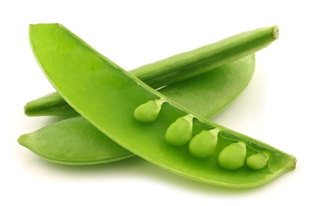 bunch of sugar snaps with one opened pod with peas visible on a white background の写真素材