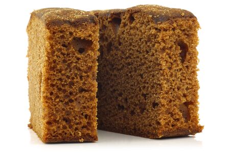 pieces of traditional Dutch dessert cake  ontbijtkoek  on a white backgroundの写真素材