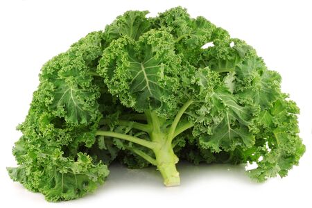 freshly harvested whole kale cabbage on a white backgroundの写真素材