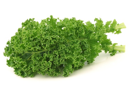 freshly harvested  kale cabbage stems on a white backgroundの写真素材
