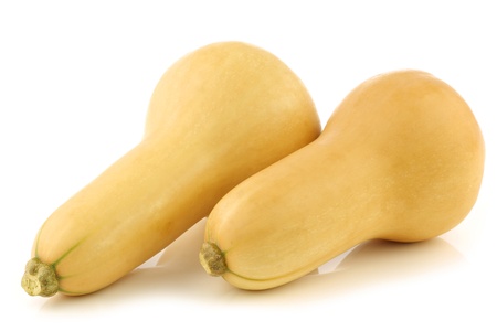 bottle shaped butternut pumpkins on a white backgroundの写真素材