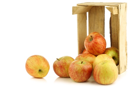 fresh  Fuji  apples in a wooden crate on a white backgroundの写真素材