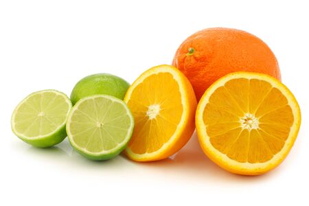 minneola, cut orange and cut lime fruit on a white backgroundの写真素材