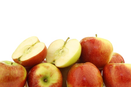 bunch of braeburn apples and a cut one on a white backgroundの写真素材