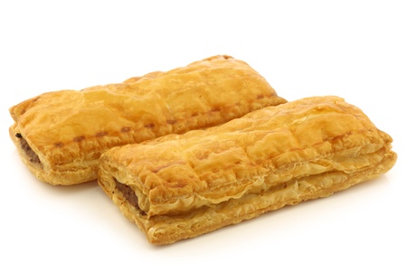 freshly baked Dutch traditional sausage rolls on a white backgroundの写真素材