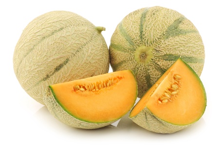 cantaloupe melons and a cut one on a white backgroundの写真素材