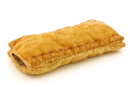 freshly baked Dutch traditional sausage roll on a white backgroundの写真素材