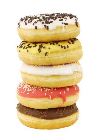 stacked assorted colorful glazed donuts with sprinkles isolated on a white backgroundの写真素材