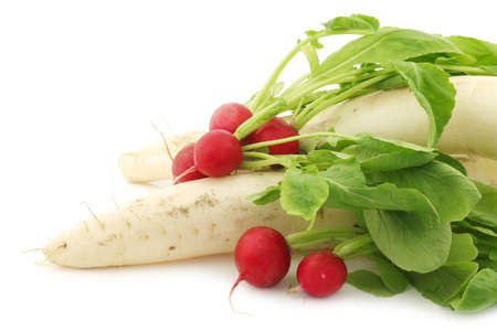 Winter radish and red radish on a white backgroundの写真素材