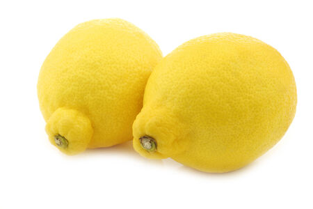 two fresh lemons on a white backgroundの写真素材
