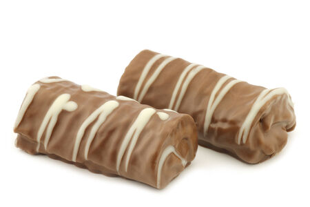delicious chocolate and cake rolls on a white backgroundの写真素材