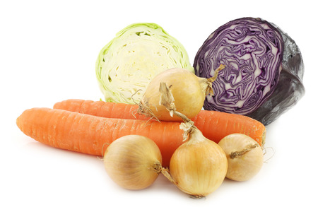 winter carrots, brown onions, red cabbage and pointed cabbage on a white backgroundの写真素材