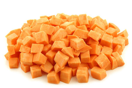 Sweet potato cubes on a white backgroundの写真素材