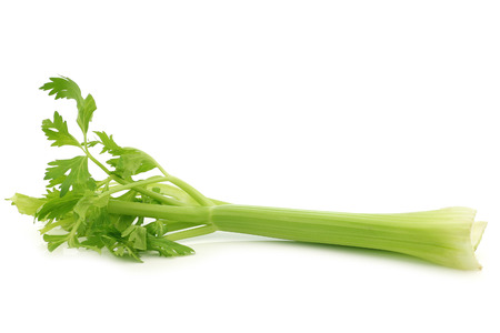 fresh celery stems on a white backgroundの写真素材