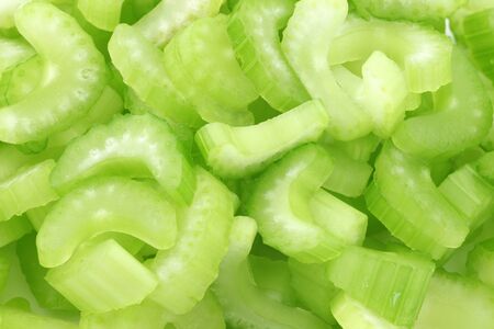 background of fresh celery piecesの写真素材