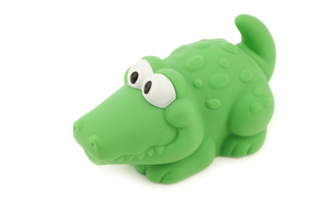 bathing crocodile toy on a white backgroundの写真素材