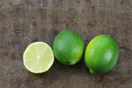 lime fruit on a grunge backgroundの写真素材