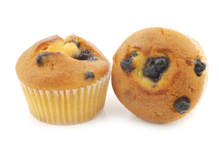 freshly baked blueberry muffins on a white backgroundの写真素材