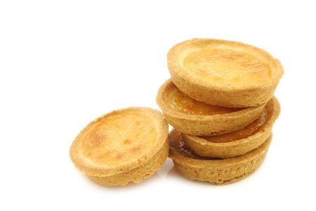 stacked filled marmalade cakes on a white backgroundの写真素材