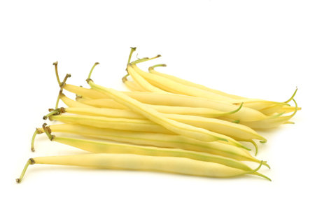 Bunch of yellow wax beans on a white background