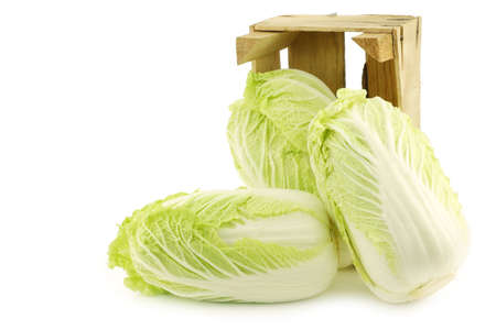 fresh chinese cabbage in a wooden crate on a white backgroundの写真素材