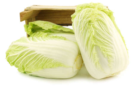 fresh chinese cabbage in a wooden crate on a white backgroundの写真素材