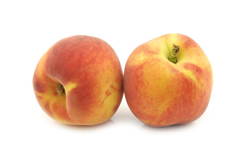 Fresh peaches on a white backgroundの写真素材
