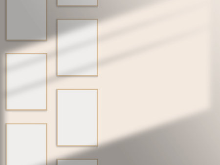 Set of multiple realistic photo frames mockup. Portrait a4 wooden frame mockup on the wall with light window shadow overlay effect. Simple, modern gallery frames mockupの写真素材