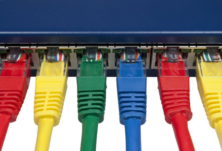 Top view of rainbow colored ethernet network cables connected to a router isolated on white backgroundの写真素材