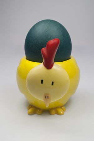 Closeup on the Blue Easter Egg placed in the Chick Egg holderの写真素材