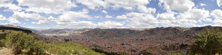 Stitched Panorama of Cuzco City from Viewpoint from Sacsayhuaman Ruins with blue cloudy sky.の写真素材