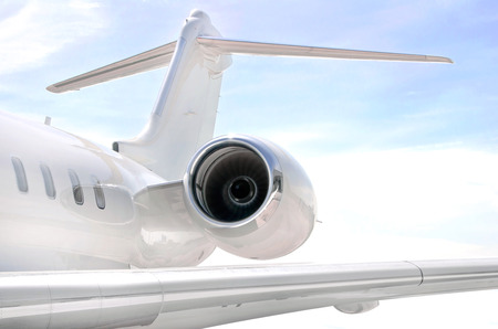 Running Jet Engine on a modern private jet airplane with a wing の写真素材