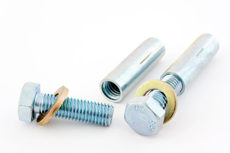 Screws, washers and dowels on a white background into