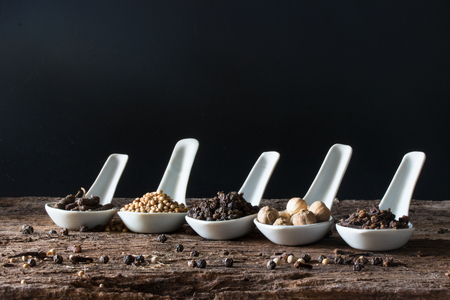 seasoning herbal in spoon on wood table for ingredient of foodの写真素材