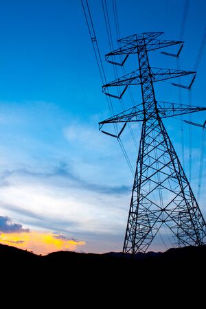 Electricity post in the sunset timeの写真素材