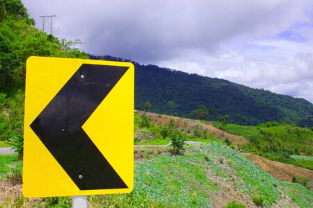 Yellow background and black signboard on mountainの写真素材