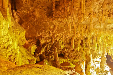 Limestone and stalactite on evening look like golden stone at Mae U Su cave,Thailandの写真素材